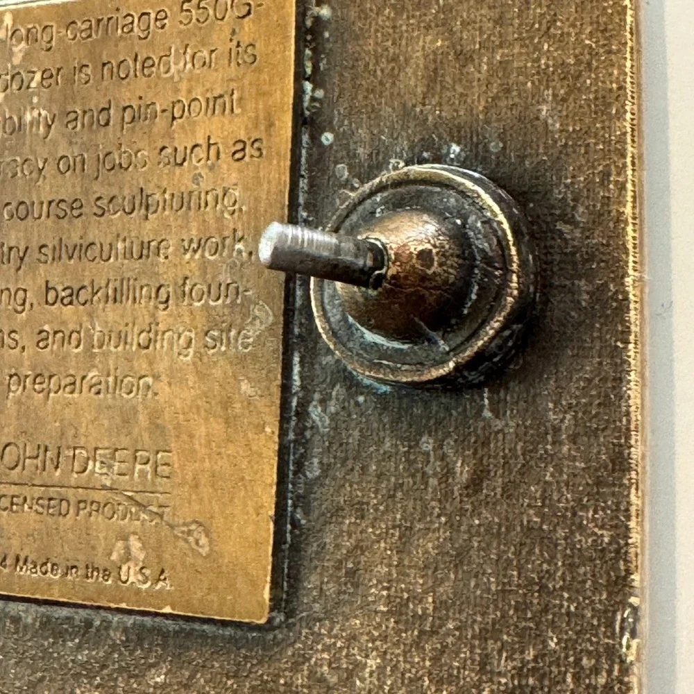 John Deere vintage brass